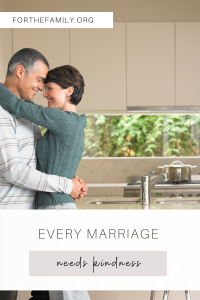 "Every Marriage Needs Kindness" - stock image of copuple hugging in a kitchen.