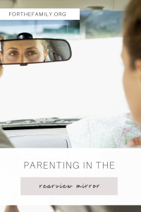 Parenting in the Rearview Mirror. Stock image of women looking in rearview mirror.